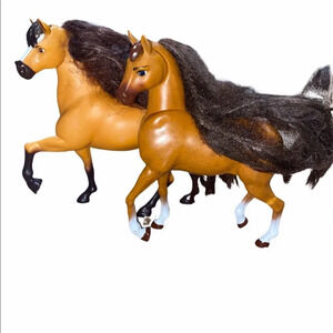 Male and female toy horses 

Hair is a bit matted but still pretty